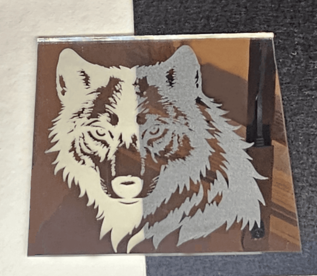 Wolf Engraved on Mirror  with Monport Onyx on White and Black Backing.