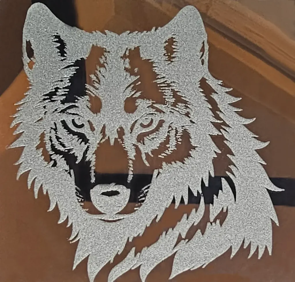 Wolf Engraved on Mirror  with Monport Onyx on White Backing.